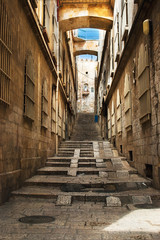 Fototapeta na wymiar Old city street, stairs, stone stairway and arch. Jerusalem, Israel