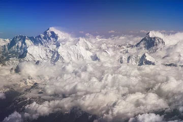 Wall murals Makalu Himalaya mountains summits, Everest and Lhotse on the left, Mt. Makalu on the right, with snow flags and clouds, view from plane