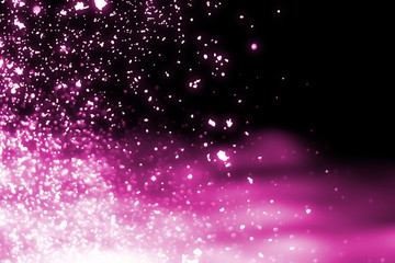 Magic festive pink particles isolated on black background. Bokeh light and sparkles. Abstract glitter lights