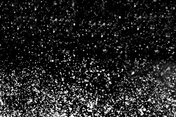 High resolution falling snow isolated on black background . Design element