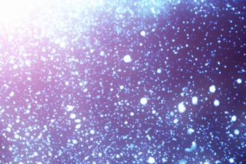 Abstract round  bokeh or glitter lights on blue background. Circles and defocused particles