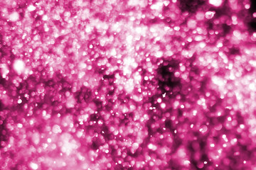 Magic festive pink or serenity background. Bokeh light and sparkles. Abstract glitter lights