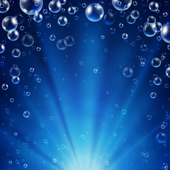 Abstract underwater background with sunlight and air bubbles