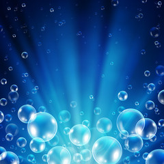 Abstract underwater background with sunlight and air bubbles