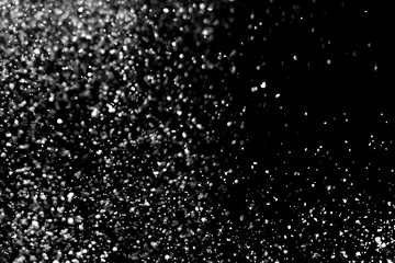 Falling realistic snow isolated on black background - design element