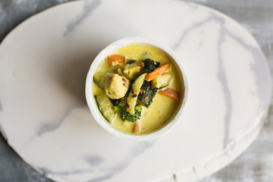 Coconut curry sauce and vegetables and chicken.