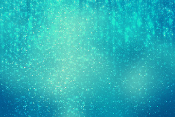 Abstract round bokeh or glitter lights on blue background. Circles defocused particles and rays