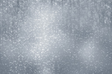 Snowflakes  and bokeh or glitter lights on silver background. Christmas abstract template