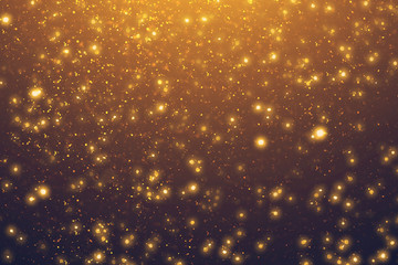 Fototapeta na wymiar Golden rays and sparkles or glitter lights. Merry Christmas festive background.defocused circle bokeh or particles