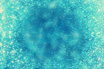 Abstract round blue bokeh or glitter lights on festive background. Circles defocused particles