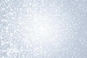 Snowflakes  and bokeh or glitter lights on silver background. Christmas abstract template