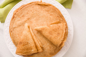 Top view on  pancakes on the plate. Dessert and homemade snacks. Healthy eating.