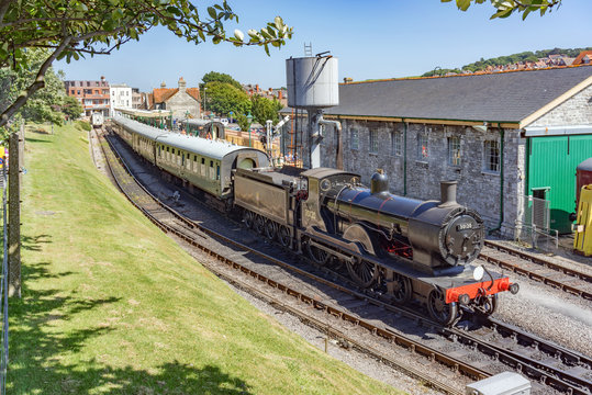 Steam Train And Carriages At Swanage Railway Station