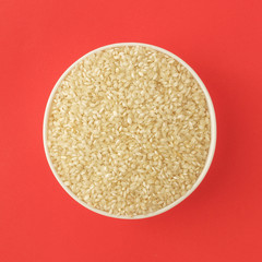 Raw medium grain rice in a bowl