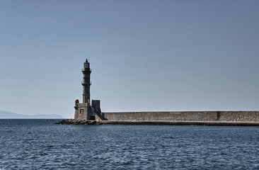Lighthouse in the old port in the evening, Chania, Crete. © GKor