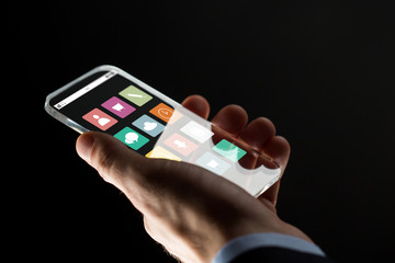 close up of businessman hand with glass smartphone