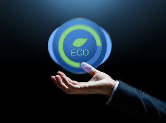close up of businessman hand with eco icon
