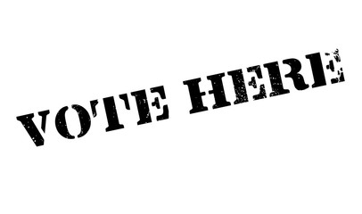 Vote Here rubber stamp. Grunge design with dust scratches. Effects can be easily removed for a clean, crisp look. Color is easily changed.