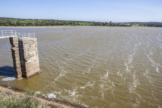 Modern footbridge attached to Dam of Cornalvo Reservoir, Extremadura, Spain