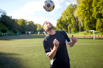 soccer player playing with ball on field
