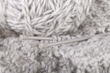 Knitting of handmade scarf.