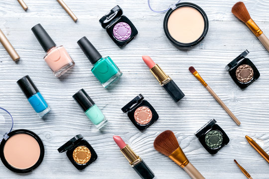 Beauty and fashion concept with decorative cosmetics on table background top view