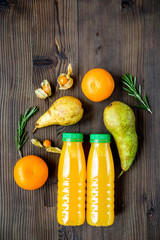 fitness smoothie in plastic bottle on wooden table top view mock-up