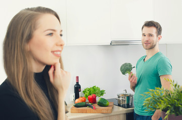 Young couple spends time together in the kitchen.