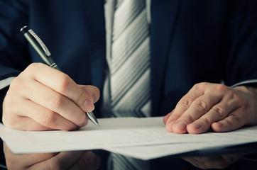 Businessman signs a contract