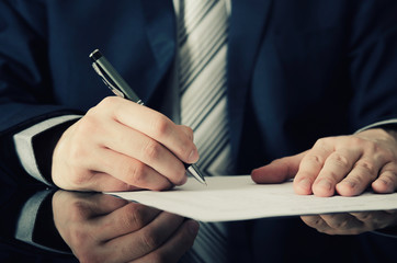 Businessman signs a contract
