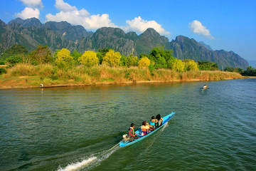 Motorboat moving on Nam Song River in Vang Vieng, Vientiane Province, Laos