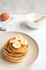 cooked pancake on plate at wooden background