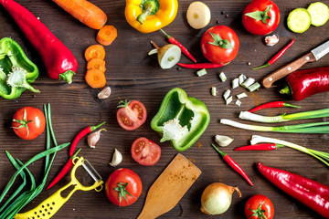 ingredients for vegetable ragout on wooden background top view