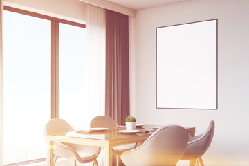 Close up of kitchen table and poster, toned