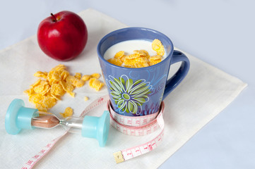 Obraz na płótnie Canvas Milk, corn flakes, apple, centimeter, hourglass, diet concept