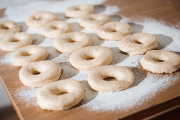 Chef preparing dough - cooking donuts process