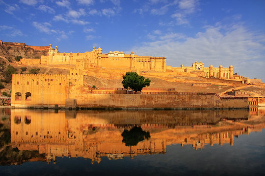 Amber Fort reflected in Maota Lake near Jaipur, Rajasthan, India.