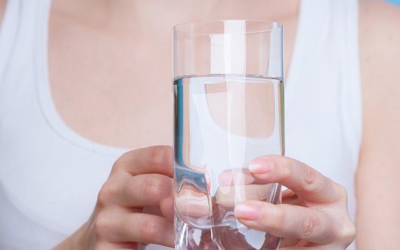 Woman holding a glass of water