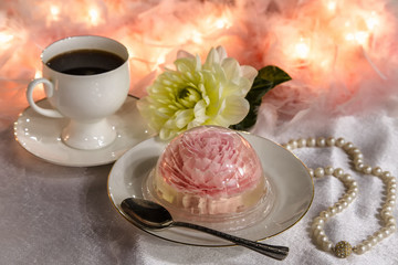 Sweet dessert. Coffee and tasty pudding. Jelly in the form of a flower