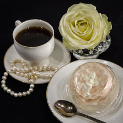 Sweet dessert. Coffee and tasty pudding. Jelly in the form of a flower