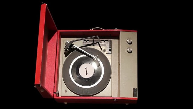 Isolated vintage record player on black background
