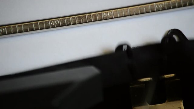 Typing the expression SUCCESS STORY with an old manual typewriter