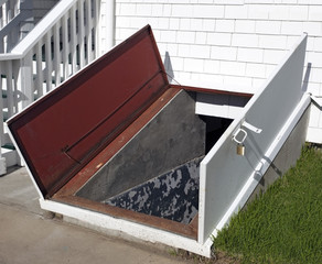 Open door to storm cellar.