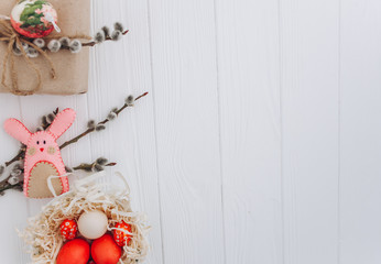 Easter concept. greeting card, eggs  and presents, rabbit on a white background
