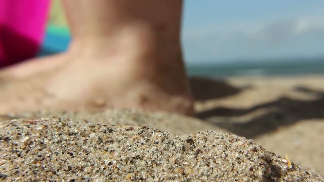 Macro shot of children playing on a sandy beach
