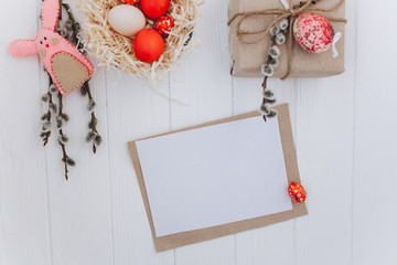 Easter concept. greeting card, eggs  and presents, rabbit on a white background