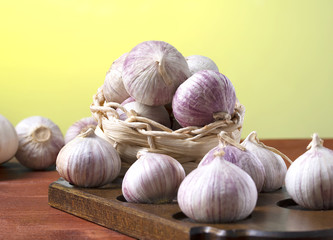 Fresh spicy garlic on a wooden table, macro
