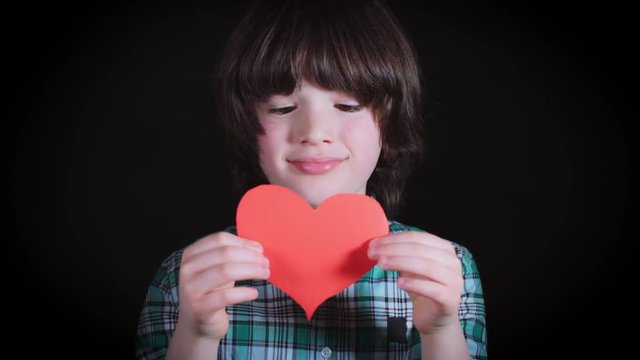 4K Cute Child Holding in Hands Paper Heart