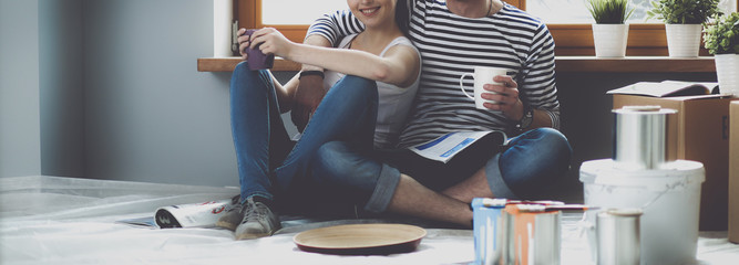 Portrait of young couple moving in new home