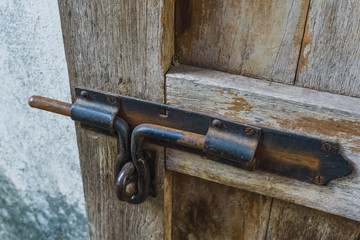 Rust door bolt on wood door